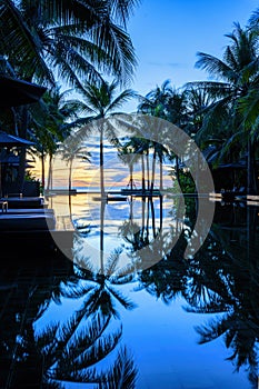 Pool and poolside bangalow at seaside resort and hotel