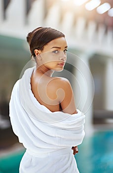 Pool, portrait and woman in robe, hotel and relax in luxury, travel and holiday for summer in resort. Vacation, calm and