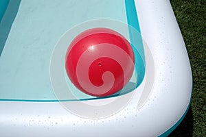 Pool and red big ball