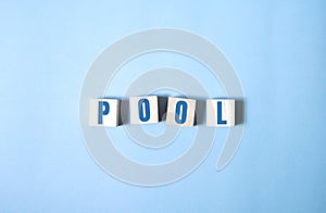 Pool spelled out in white alphabet blocks