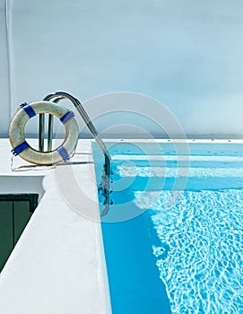 Pool with steps and life guard buoy ring