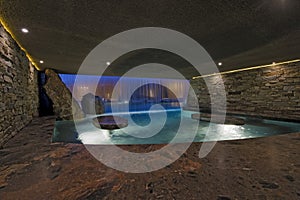 Pool With Stone Walls At Night