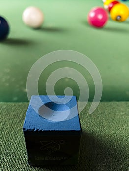 Pool table with blue chalk photo