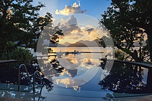 Pool at tropical beach on Cerf Island at sunset