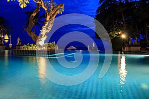 Pool in the tropics at the blue hour