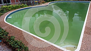 A pool turns green when there is algae in the water