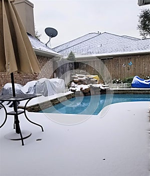 Pool under snow in Houston, Texas