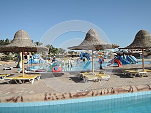 Pool view panorama of colourful tropical kid s aquapark. Concept of relaxation and fun