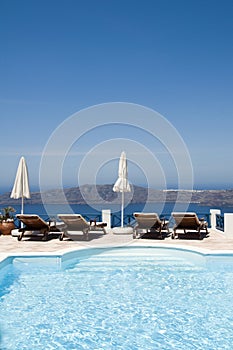 pool view of volcanic island santorini