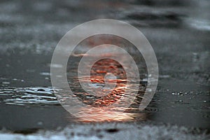 A pool of water in the rain.