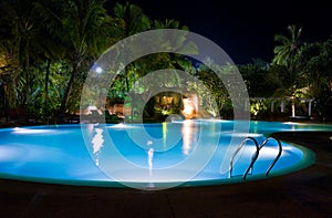 Pool and waterfall at night