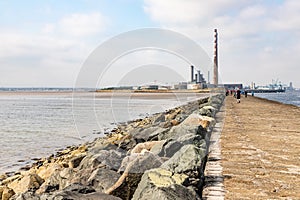 Poolbeg lighthouse path and Power plant in Dublin port