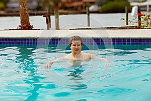 Poolman swimming in the pool photo