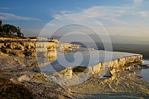 The pools of Pamukkale during evening photo