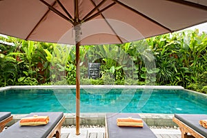 Poolside and big parasol