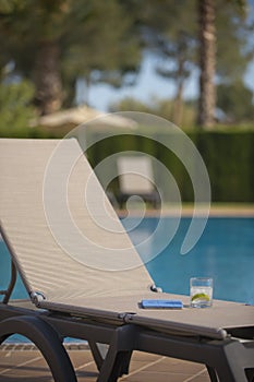 Poolside Lounge Chair With Drink and Tablet