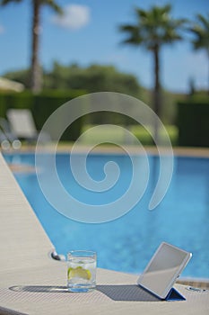 Poolside Lounge Chair With Drink and Tablet