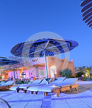 Poolside loungers at dusk