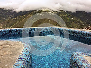 POOLSIDE OVERLOOKING ANDES MOUNTAINS, BANOS ECUADOR