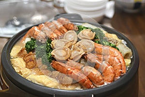 Poon Choi or Pen Cai, traditional Cantonese dish comprised of a number of ingredients