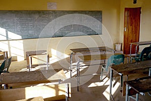 Poor african classroom with empty desks