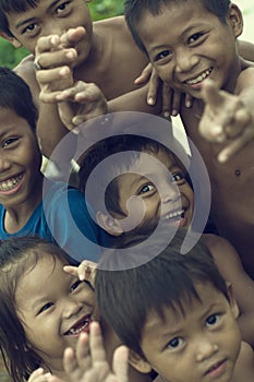 Poor cambodian kids smiling and playing