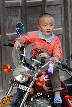 Poor child in the old village in China