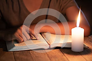Poor children read books using candles for lighting., Disadvantaged Children doing homework, Education Concept photo
