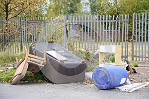 Poor council flats with fly tipping of rubbish outdoors Inverclyde Scotland