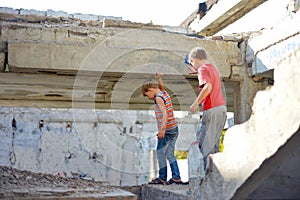 Poor and dirty street children living on an abandoned construction site. a concept of the life of street children orphans