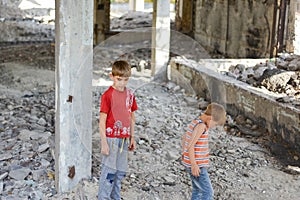 Poor and dirty street children living on an abandoned construction site. a concept of the life of street children orphans