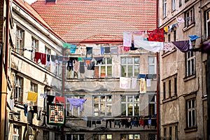 Poor district. Clothes hanging to dry on a clothes-line. Laundry dryings on the rope. Washed clothes drying outside of