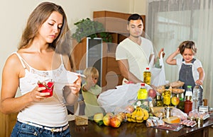 Poor family with bags of food