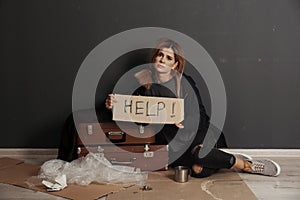 Poor homeless woman asking for help