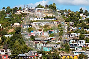 Poor houses on the hills of a small town named Tome in Chile