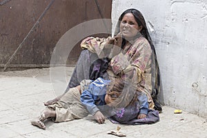 Poor Indian beggar family on street in Ladakh. India