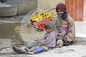 Poor Indian beggar family on street in Leh, Ladakh, India