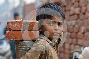 Poor indian boy holding brick for poverty illustration