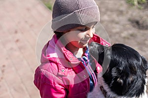 poor little girl with a dog in village