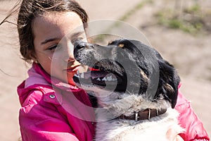 poor little girl with a dog in village