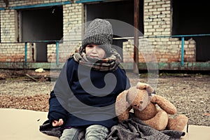 Poor little girl with toy rabbit