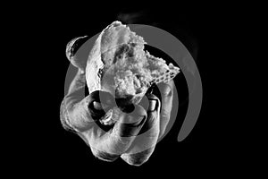 Poor Man sharing Bread, Helping Hand Concept. B&W close up
