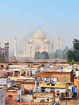Poor neighborhoods and luxurious Taj Mahal. Agra, India
