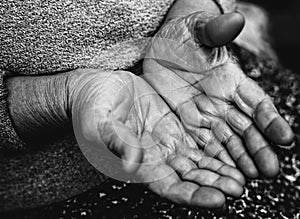 Poor old hands of homeless beggar photo