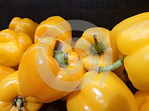 Yellow bell pepper with flaws in supermarket photo