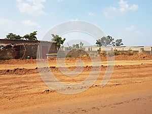 Poor streets of Bamako, Mali with red Arican soil