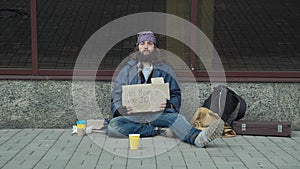 Poor unemployed man begging in street