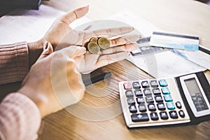 Poor woman hand holding coin after payday, bankruptcy broke