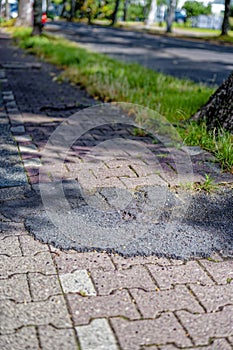 Poorly repaired bicycle lane with a bumpy edge in Berlin