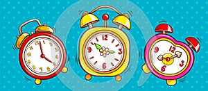 Pop art alarm clocks set on half tone background.